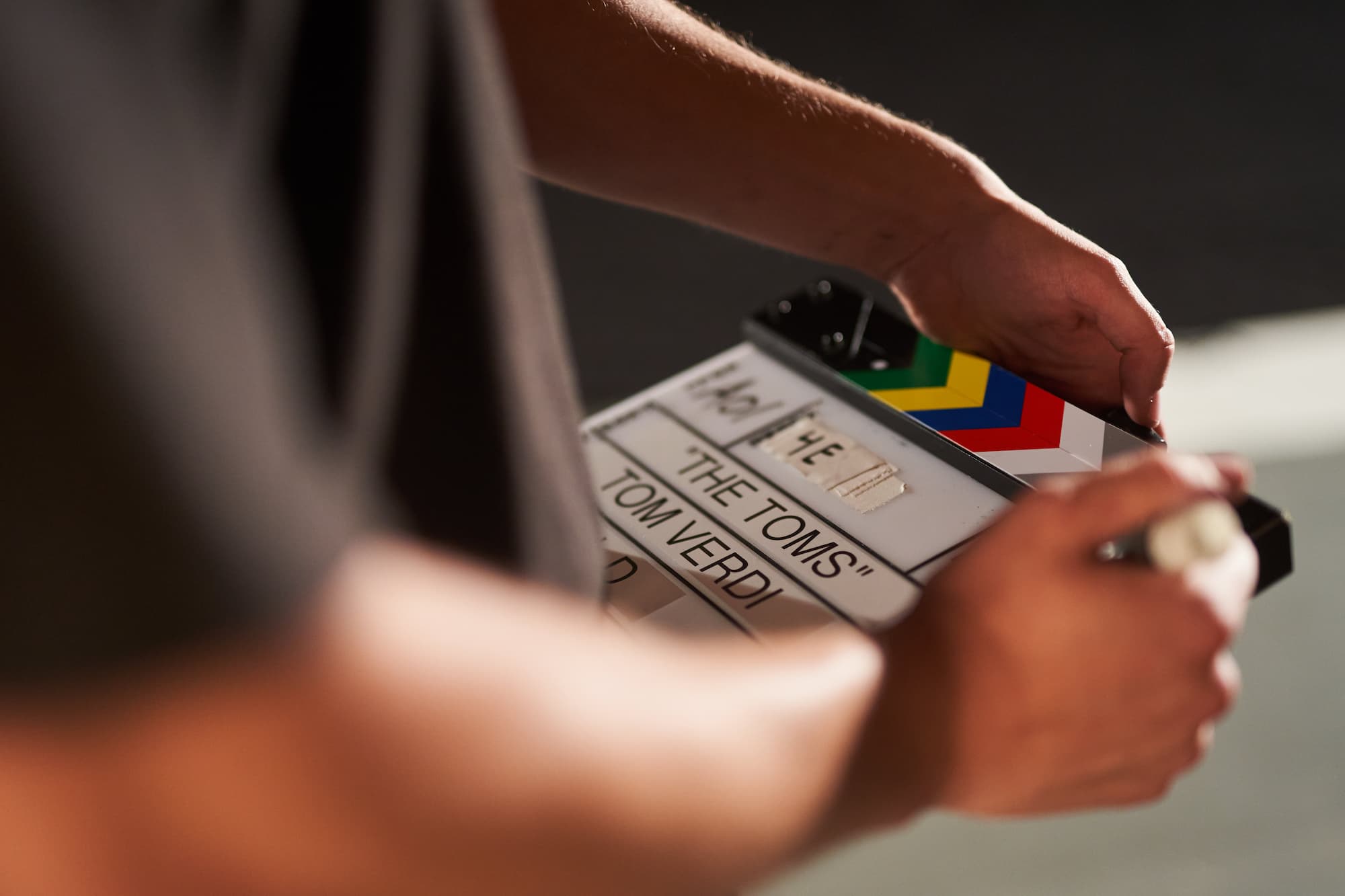 Thomas Verdi on set with a film slate